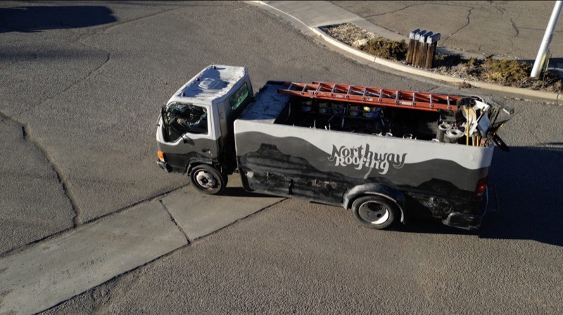 Northway Roofing branded service truck - aerial drone view showing the mountain wave design