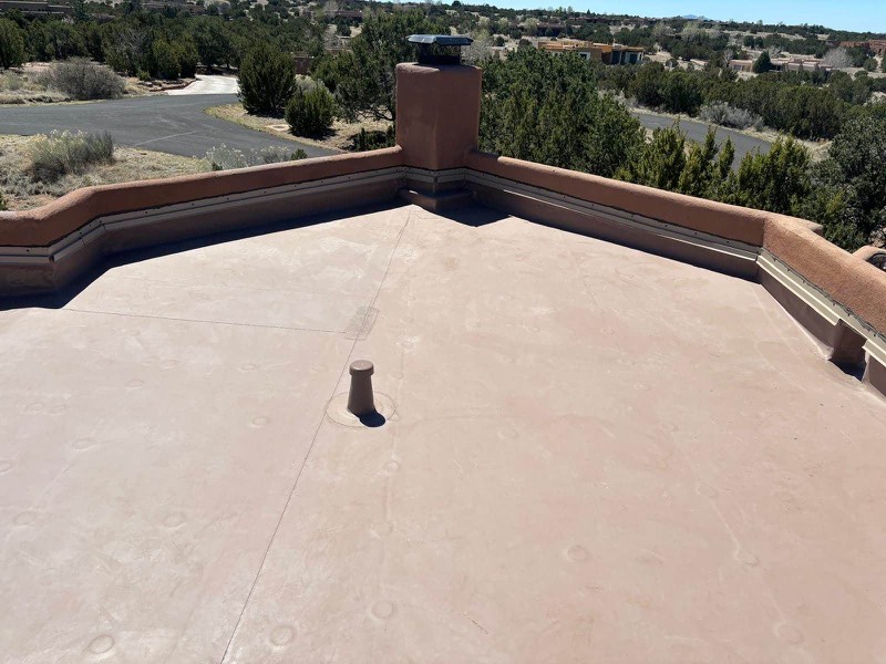 TPO membrane installation showing sealed seams on a flat commercial roof in Santa Fe